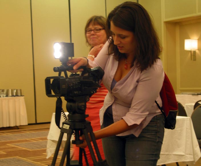 A film crew sets up to interview Tom Reese.